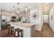Modern kitchen with stainless steel appliances and an island with seating at 1703 N Tamiami Trl # 210, Sarasota, FL 34234