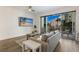 Living room with sliding doors to balcony and a modern design at 1703 N Tamiami Trl # 210, Sarasota, FL 34234