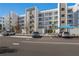 Parking lot with cars parked in front of the apartment building at 1703 N Tamiami Trl # 210, Sarasota, FL 34234