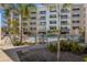 Resort-style pool with lounge chairs and tropical landscaping at 1703 N Tamiami Trl # 210, Sarasota, FL 34234