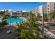 Resort-style pool and spa with lush landscaping and comfortable seating at 1703 N Tamiami Trl # 210, Sarasota, FL 34234