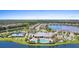 Aerial view showing community pool, tennis courts, and lakefront location at 17335 Polo Trl, Bradenton, FL 34211