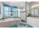 Beautiful bathroom with a soaking tub, glass enclosed shower and dual sink vanity at 17335 Polo Trl, Bradenton, FL 34211