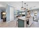 Open concept kitchen with granite countertops, stainless steel appliances, and easy access to the living room at 17335 Polo Trl, Bradenton, FL 34211