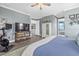 Main bedroom with king-size bed, TV, and exercise bike at 17335 Polo Trl, Bradenton, FL 34211
