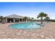 Resort-style pool with inviting lounge chairs, complemented by swaying palm trees and a well-appointed clubhouse at 17335 Polo Trl, Bradenton, FL 34211
