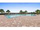 Relaxing resort-style pool with plenty of lounge chairs at 17335 Polo Trl, Bradenton, FL 34211