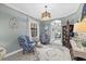 Cozy sitting area with two armchairs, a rug, and decorative elements at 17335 Polo Trl, Bradenton, FL 34211