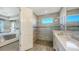 Clean bathroom with a walk-in shower and a single vanity at 1825 Twin Rivers Trl, Parrish, FL 34219