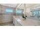 Spa-like bathroom with a walk-in shower and modern vanity at 1825 Twin Rivers Trl, Parrish, FL 34219