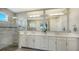 Elegant bathroom with double vanity and a walk-in shower at 1825 Twin Rivers Trl, Parrish, FL 34219