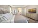 Bright bedroom with ensuite bathroom access and a large bed at 1825 Twin Rivers Trl, Parrish, FL 34219