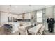 Kitchen and dining area with white table and chairs at 1825 Twin Rivers Trl, Parrish, FL 34219