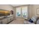 Gathering room with large windows, comfortable seating, and a TV at 1825 Twin Rivers Trl, Parrish, FL 34219