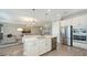 Open concept kitchen with island and stainless steel appliances at 1825 Twin Rivers Trl, Parrish, FL 34219