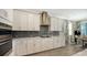 Modern kitchen with stainless steel appliances and white cabinetry at 1825 Twin Rivers Trl, Parrish, FL 34219