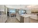 Open concept kitchen island with stainless steel appliances at 1825 Twin Rivers Trl, Parrish, FL 34219