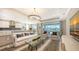 Open concept kitchen and living area with modern appliances and island at 1825 Twin Rivers Trl, Parrish, FL 34219