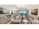 Open concept kitchen and living area with modern appliances and island at 1825 Twin Rivers Trl, Parrish, FL 34219