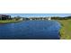 Water view of lake and homes at 1825 Twin Rivers Trl, Parrish, FL 34219