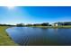 Serene lakefront view of homes at 1825 Twin Rivers Trl, Parrish, FL 34219