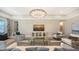 Spacious living room with comfortable seating and large TV at 1825 Twin Rivers Trl, Parrish, FL 34219