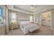 Spacious main bedroom with plush bed and ensuite bathroom at 1825 Twin Rivers Trl, Parrish, FL 34219