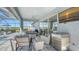 Outdoor kitchen and seating area, perfect for entertaining, adjacent to the pool at 1825 Twin Rivers Trl, Parrish, FL 34219