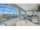 Enjoy al fresco dining on this patio, steps away from the refreshing pool and serene lake at 1825 Twin Rivers Trl, Parrish, FL 34219