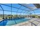 Enclosed pool and patio area with lake view at 1825 Twin Rivers Trl, Parrish, FL 34219