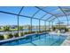 Enclosed pool area with water feature and lake view at 1825 Twin Rivers Trl, Parrish, FL 34219