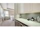 Convenient wet bar with beverage fridge and quartz countertop at 1825 Twin Rivers Trl, Parrish, FL 34219