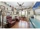 Cozy sitting room featuring leather recliners and eclectic decor at 197 Grand Oak Cir, Venice, FL 34292