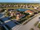 House in a neighborhood near a lake, showing surrounding homes and streets at 20680 Vita Ct, Venice, FL 34293