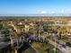 Gated community entrance with palm trees and landscaping at 20680 Vita Ct, Venice, FL 34293