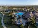 Luxury community clubhouse with pool and expansive grounds at 20680 Vita Ct, Venice, FL 34293