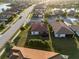 Backyard of house with screened enclosure, part of a larger community at 20680 Vita Ct, Venice, FL 34293
