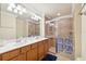 Elegant bathroom with double vanity and large walk-in shower at 20680 Vita Ct, Venice, FL 34293