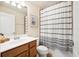 Clean bathroom with shower/tub combo and striped curtain at 20680 Vita Ct, Venice, FL 34293