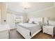 Bright bedroom with king-size bed and access to backyard at 20680 Vita Ct, Venice, FL 34293