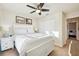 King-size bed in sunny bedroom with access to another room at 20680 Vita Ct, Venice, FL 34293