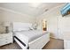 Spacious Primary bedroom with white furniture and carpet flooring at 20680 Vita Ct, Venice, FL 34293