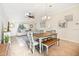 Bright dining area with a table and chairs, adjacent to the living room at 20680 Vita Ct, Venice, FL 34293