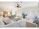 Bright living room with comfy sofas, a coffee table, and a fireplace at 20680 Vita Ct, Venice, FL 34293