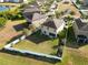 Aerial view of a two-story house with a fenced-in backyard at 2112 Richwood Pike Dr, Ruskin, FL 33570