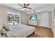 Bright bedroom with a king-size bed, access to the backyard, and a ceiling fan at 214 Gaines Ave, Sarasota, FL 34243