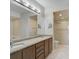 Double vanity bathroom with granite countertop and large walk-in shower at 2251 Jessie Harbor Dr # 2101, Osprey, FL 34229