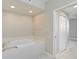 Oval bathtub with grab bars in a bright bathroom at 2251 Jessie Harbor Dr # 2101, Osprey, FL 34229