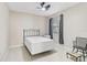 Simple bedroom with a bed and small chair at 2251 Jessie Harbor Dr # 2101, Osprey, FL 34229