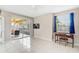 Relaxing bedroom with tile floors, ceiling fan, and private balcony access at 2251 Jessie Harbor Dr # 2101, Osprey, FL 34229